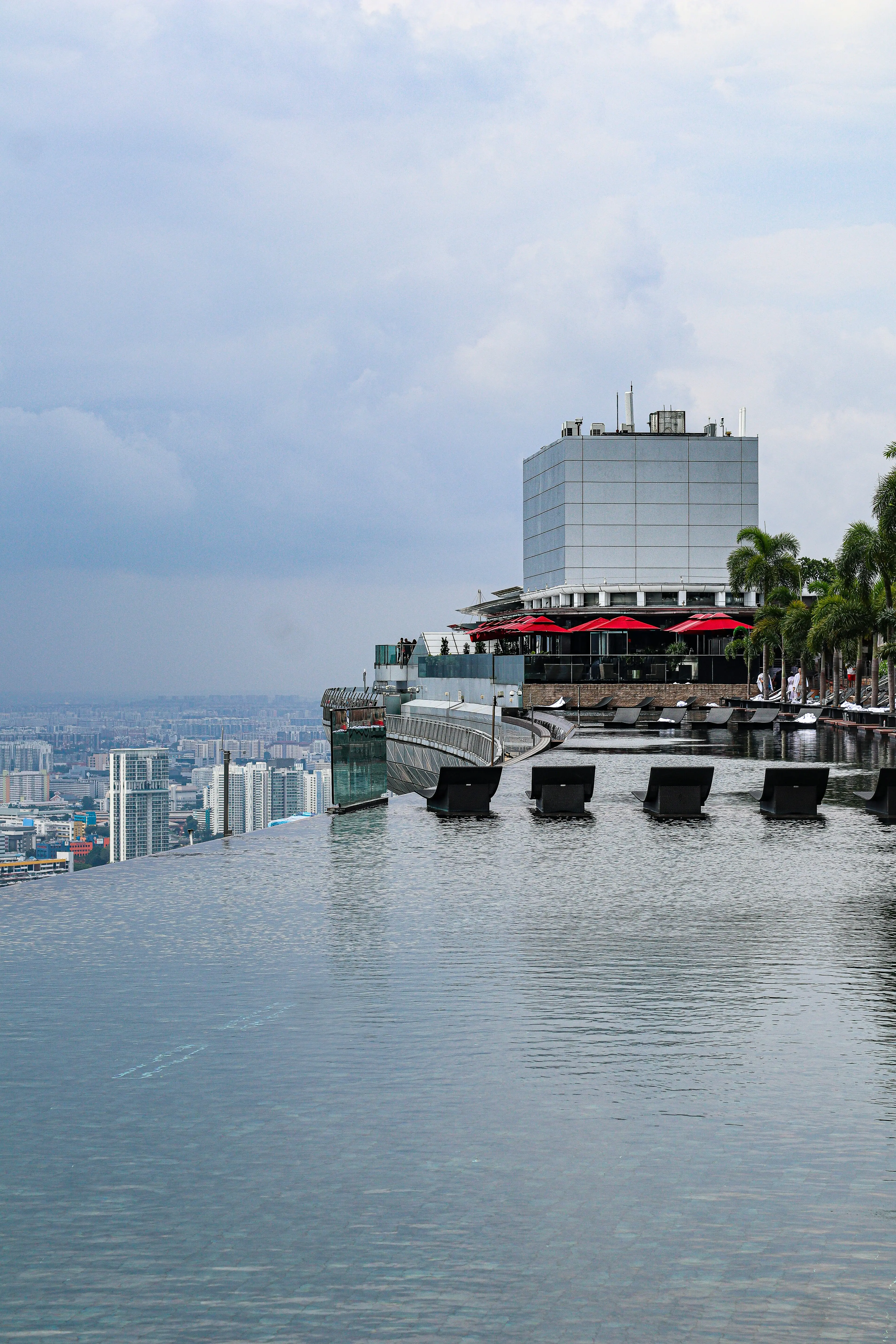 Hotel infinity pool with city skyline view